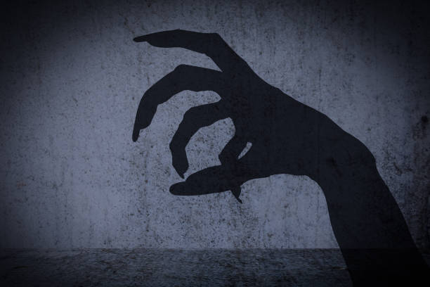 istock Afraid of a big monster claw shadow 641691254
