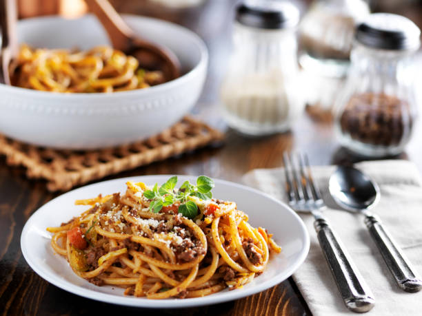 istock spaghetti pasta dinner on plate with meat sauce and oregano 641693892