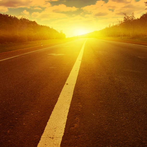 istock Country road at sunset. 641696388