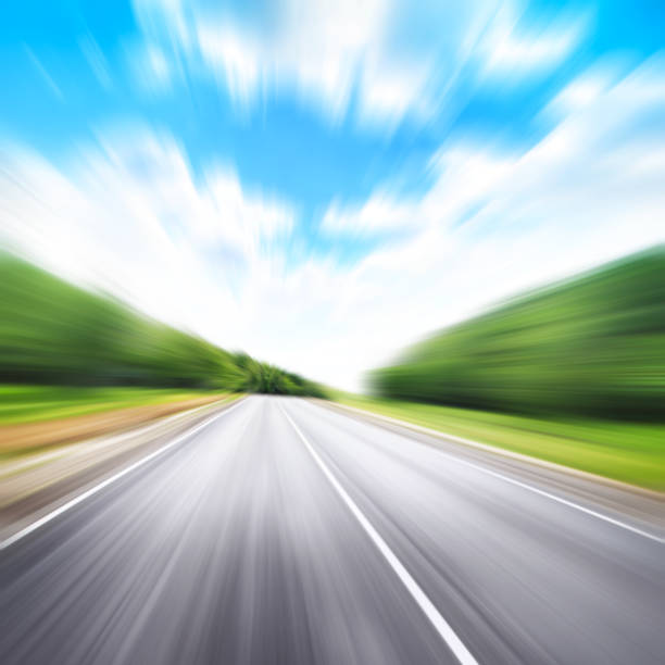 istock Country road in motion blur. 641696390