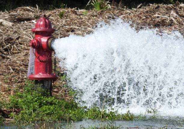 Fire Hydrant Fire Hydrant flushing out the water. flushing water stock pictures, royalty-free photos & images