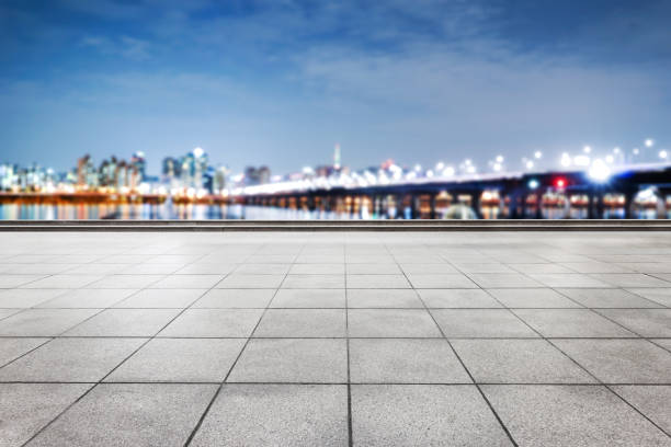 istock empty brick floor with modern city at night 641698000