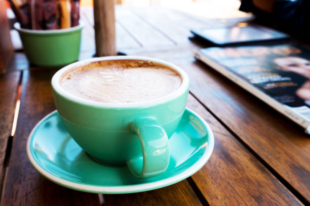 cup of coffee on wood table