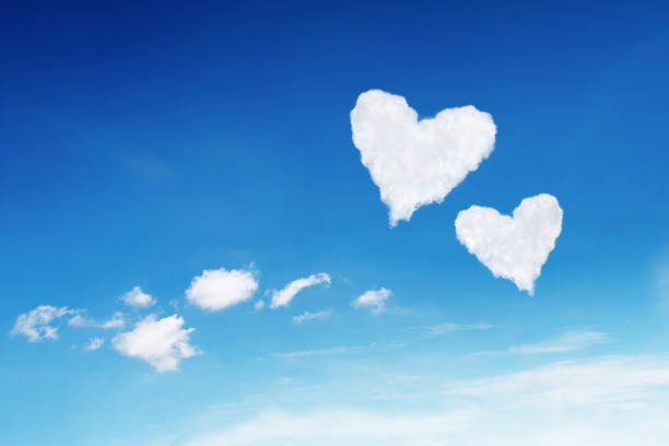 istock couple white heart shaped clouds on blue sky 641708002