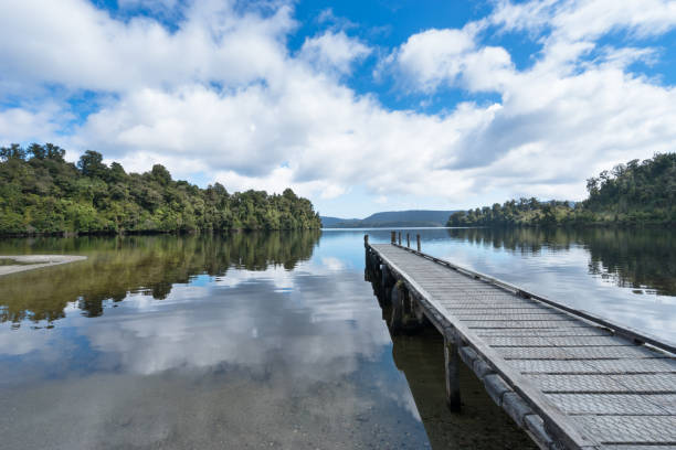 istock wood footpath in tranquil beautiful lake in blue sky 641708214