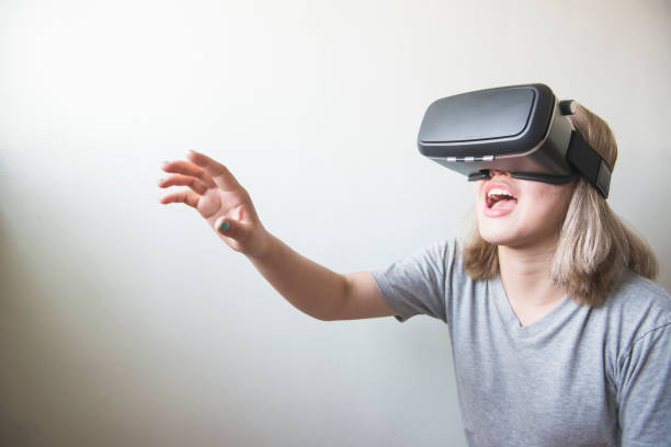 istock woman using the virtual reality headset on white background 641711958