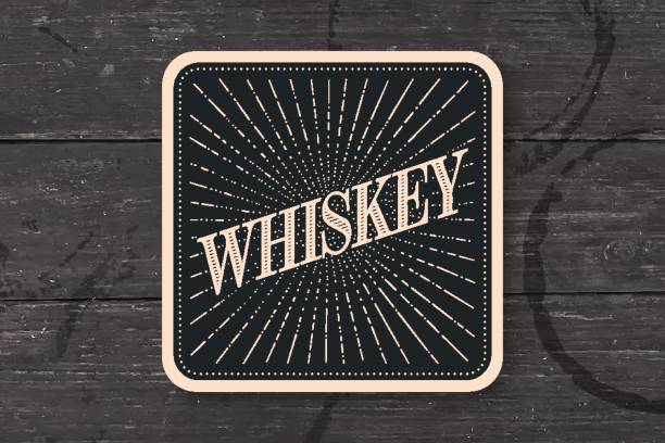 Beverage coaster for glass with inscription Whiskey Beverage coaster for glass with inscription Whiskey, light rays and sunburst. Vintage drawing for bar, pub, whiskey themes. Square for placing whiskey drink in glass or a bottle. Vector Illustration irish punt note stock illustrations