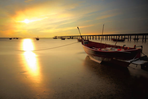 istock Fishing boat at sunset 641714776