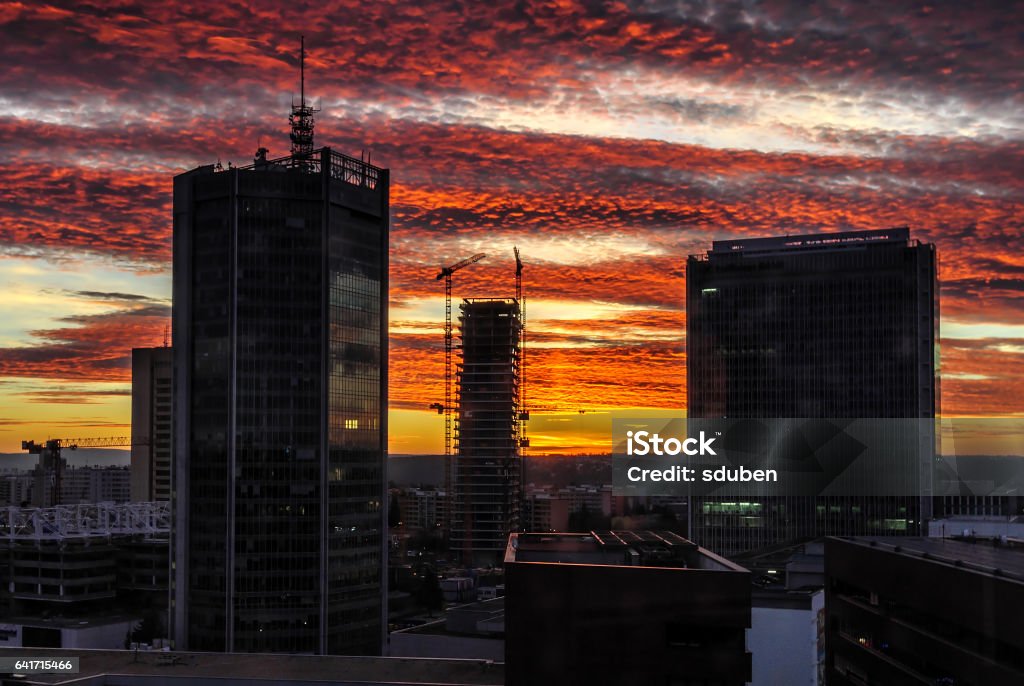Skyscrapers with dramatic colorfull sunset - business center - modern urban Skyscrapers with dramatic colorfull sunset. Prague business center. Modern urban style. Construction of skyscraper. Architecture Stock Photo Skyscrapers with dramatic colorfull sunset - business center - modern urban Skyscrapers with dramatic colorfull sunset. Prague business center. Modern urban style. Construction of skyscraper. Architecture Stock Photo