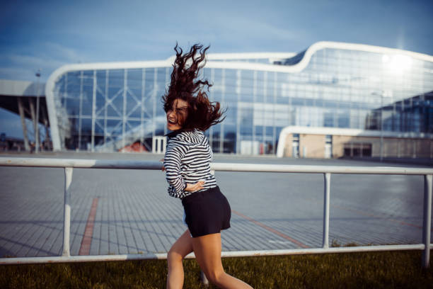 istock young carefree woman jumping 641715984