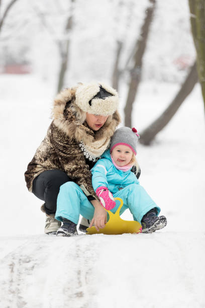istock A three year on snow with grandma 641717440