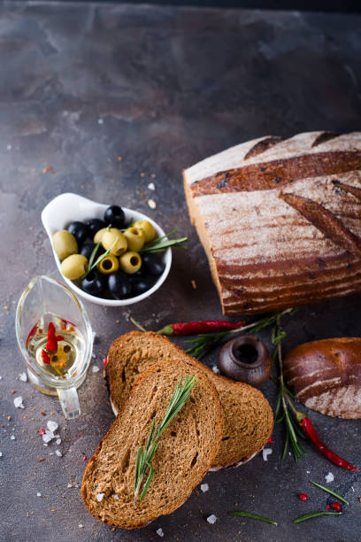 istock Fresh bread with olive oil and olives 641718922