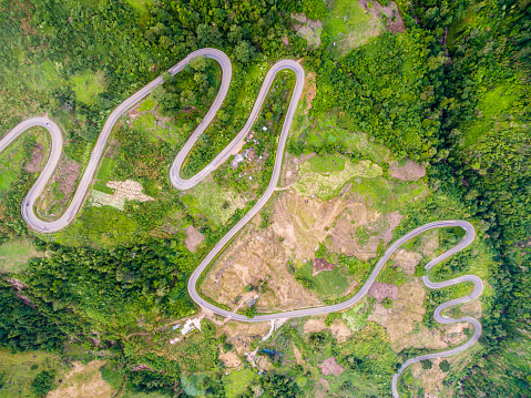 Aerial view of crooked path of road on the mountain, Shot from drone
