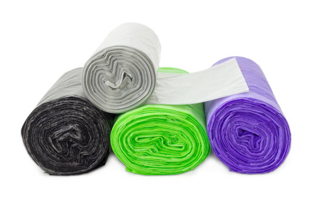 istock Garbage bags in rolls of different sizes and colors closeup 641721708