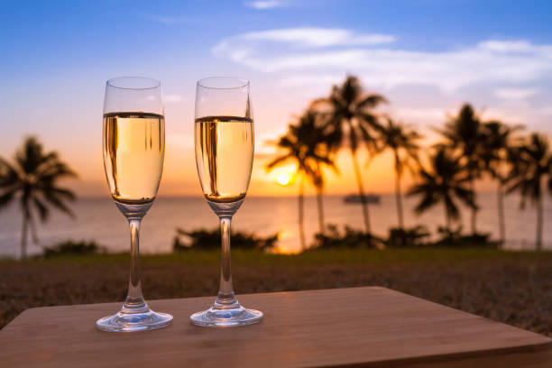 istock Couple of champagne glasses with beautiful beach setting 641724366
