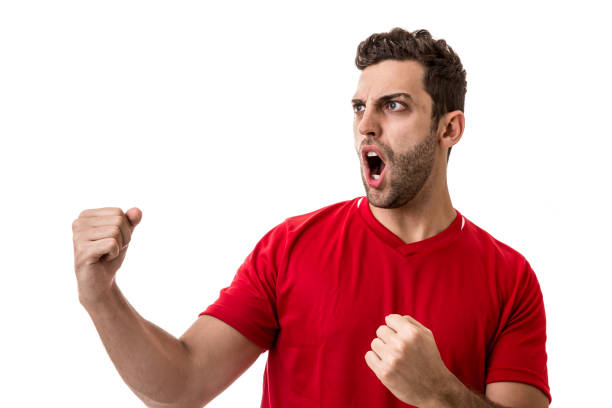 istock Fan / Sport Player on red uniform celebrating on white background 641727126