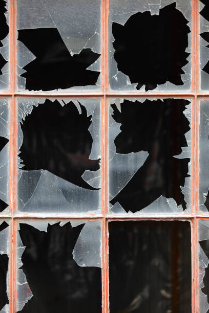 istock Damage window with broken glass and dark background 641728216