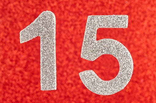 Number fifteen white color over a red background. Anniversary. Horizontal