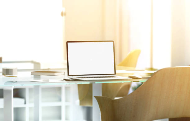 istock Blank laptop screen mockup in sunny office, depth of field 641729300