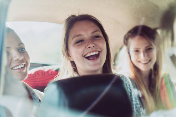 istock Young female friends having fun on road trip 641730882