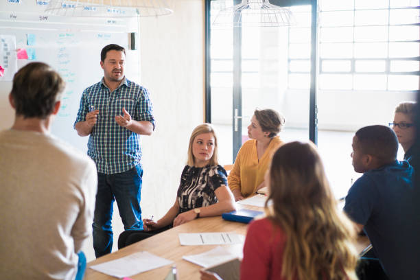 istock Businessman giving presentation in creative office 641731548