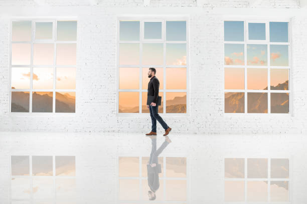 istock Businessman in the white office interior 641732962