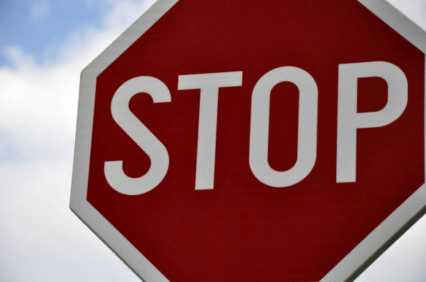 istock Stop sign for traffic against blue sky 641733132