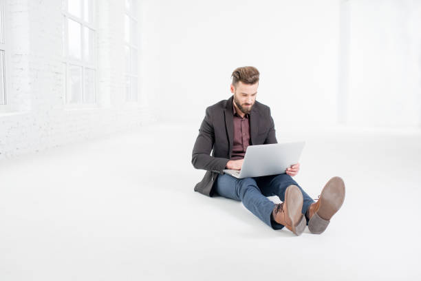 istock Businessman in the white office interior 641733338
