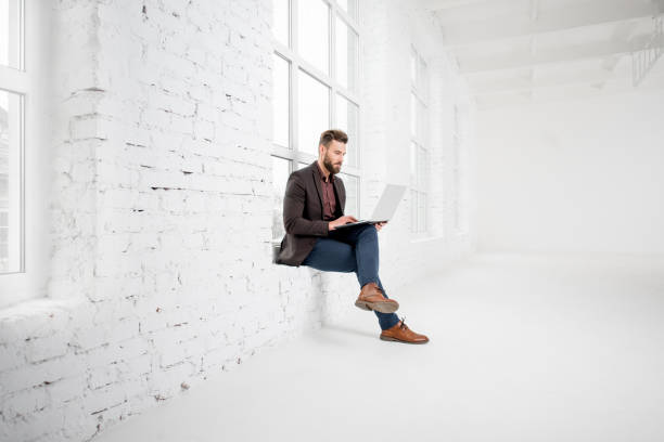 istock Businessman in the white office interior 641733770