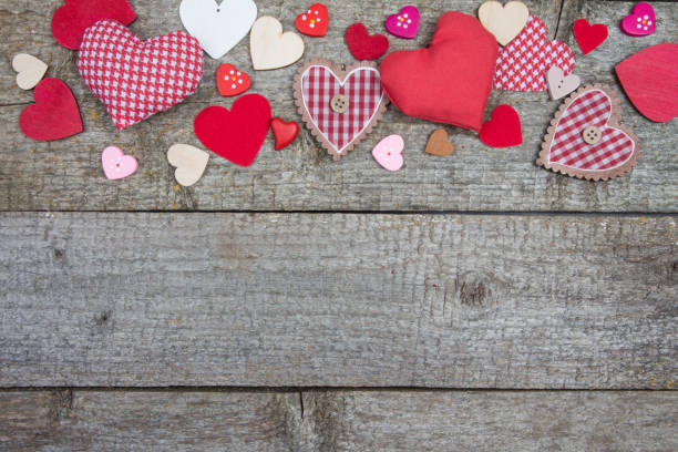istock Lots of different hearts on gray old wooden rustic table. 641734596
