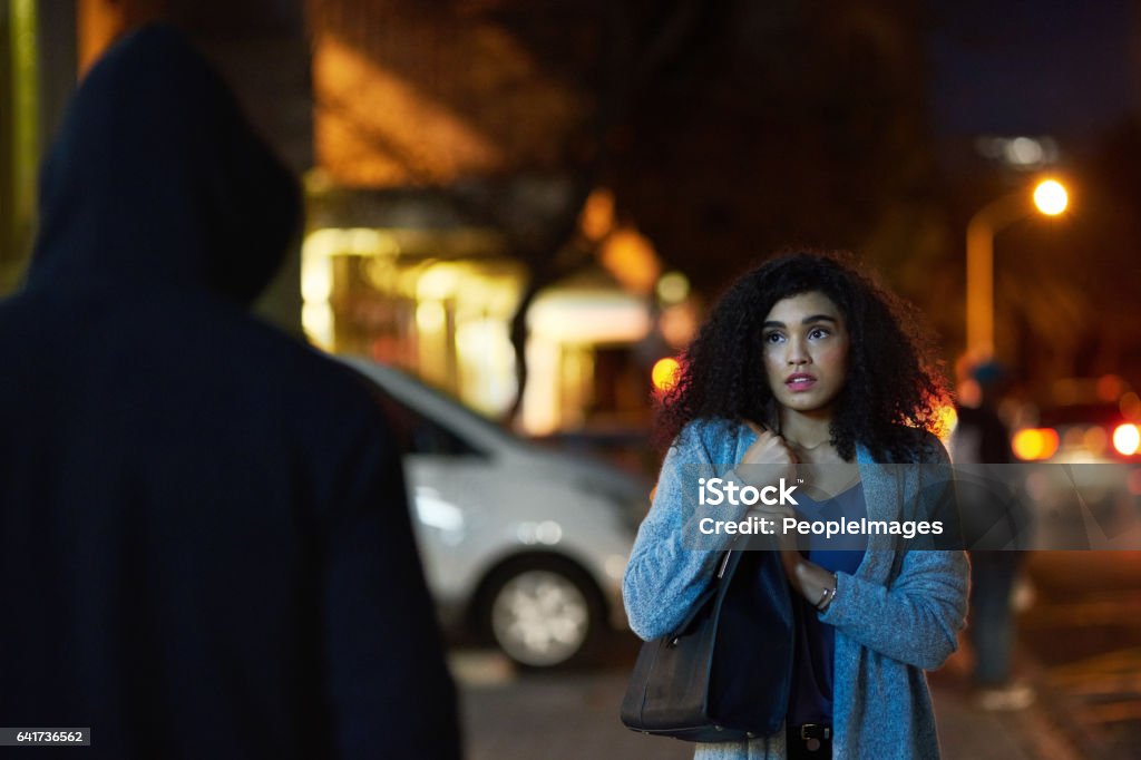 Crime has become quite widespread in the city Cropped shot of a frightened young woman being targeted by a thief Stalking - Animal Hunting Stock Photo