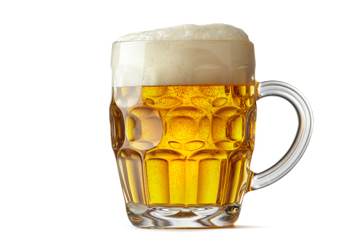 big beer mug with beer and foam on a wooden background with boards