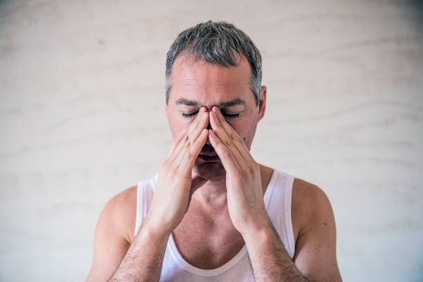 istock Man feeling strong headache, massaging his nose 641737496