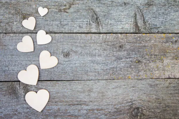 Wooden heart on an old rustic table. Space for your text