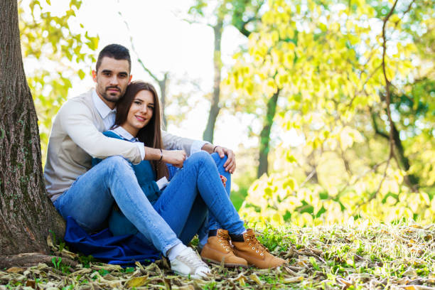 istock Happy young couple at the park 641740056
