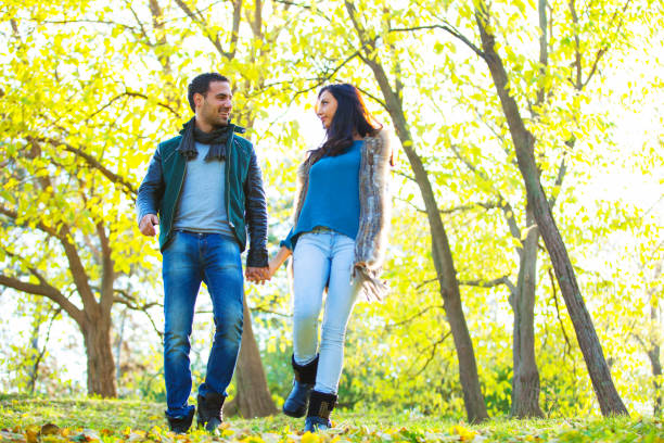 istock Happy young couple at the park 641740080