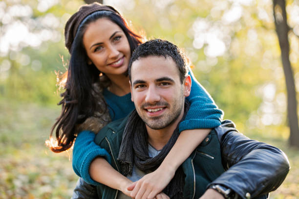 istock Happy young couple at the park 641740088