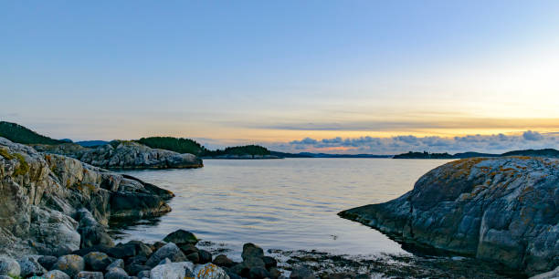 Summer sunset over the Boknafjord seen from Tingholmen Island east of the city of Stavanger in Norway at the end of a beautiful day.