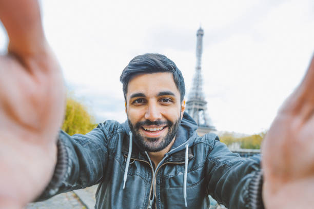 istock Young man taking selfie with smartphone 641744792