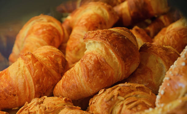istock Freshly baked golden croissants close up 641746514