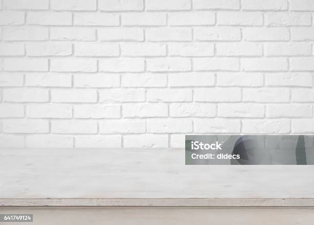 Vintage Empty Wooden Table On Defocused White Brick Wall Background Stock Photo - Download Image Now