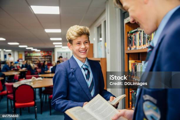 Teens At The Library Stock Photo - Download Image Now - School Building, Education, Library