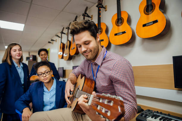 istock Giving A Music Lesson 641754894