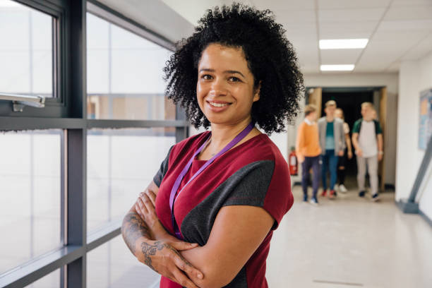 istock Teacher In The Hallway 641755186