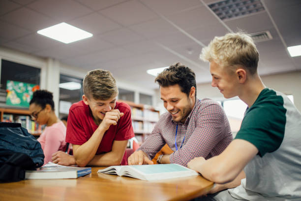 receiving help in lessons - high school high school student classroom group of people imagens e fotografias de stock