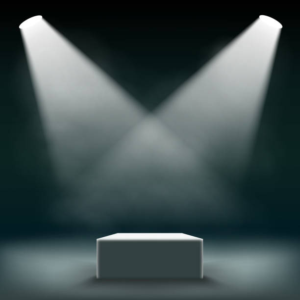 istock Podium for the exhibition and awards ceremony is illuminated by searchlights. 641756036