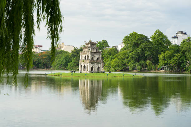istock Hoan Kiem lake (Sword lake, Ho Guom) in Hanoi, Vietnam with willow branches on foreground 641757736