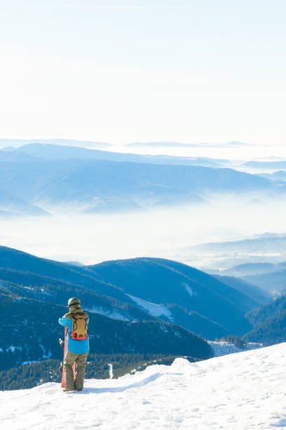 istock Snowboarder at the top of a mountain 641760820