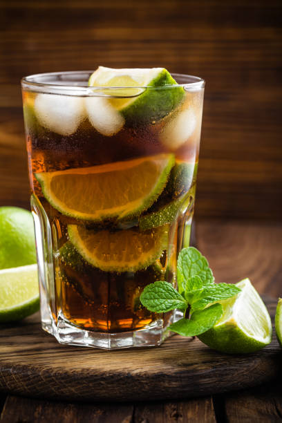 istock Cuba Libre cocktail with cola, lime and ice in glass, cold longdrink 641766280