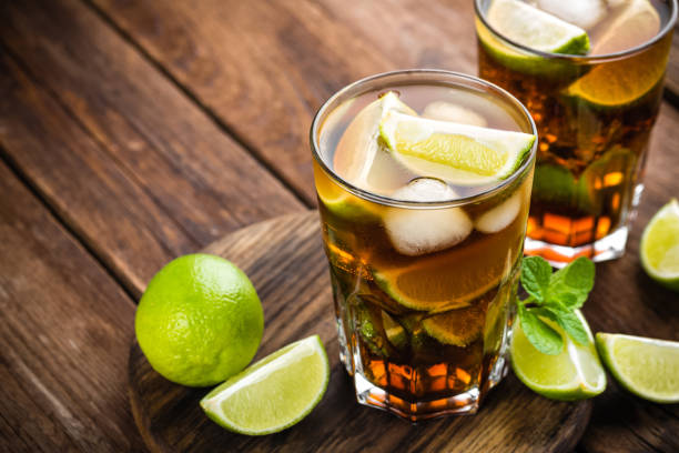 istock Cuba Libre cocktail with cola, lime and ice in glass, cold longdrink 641766288